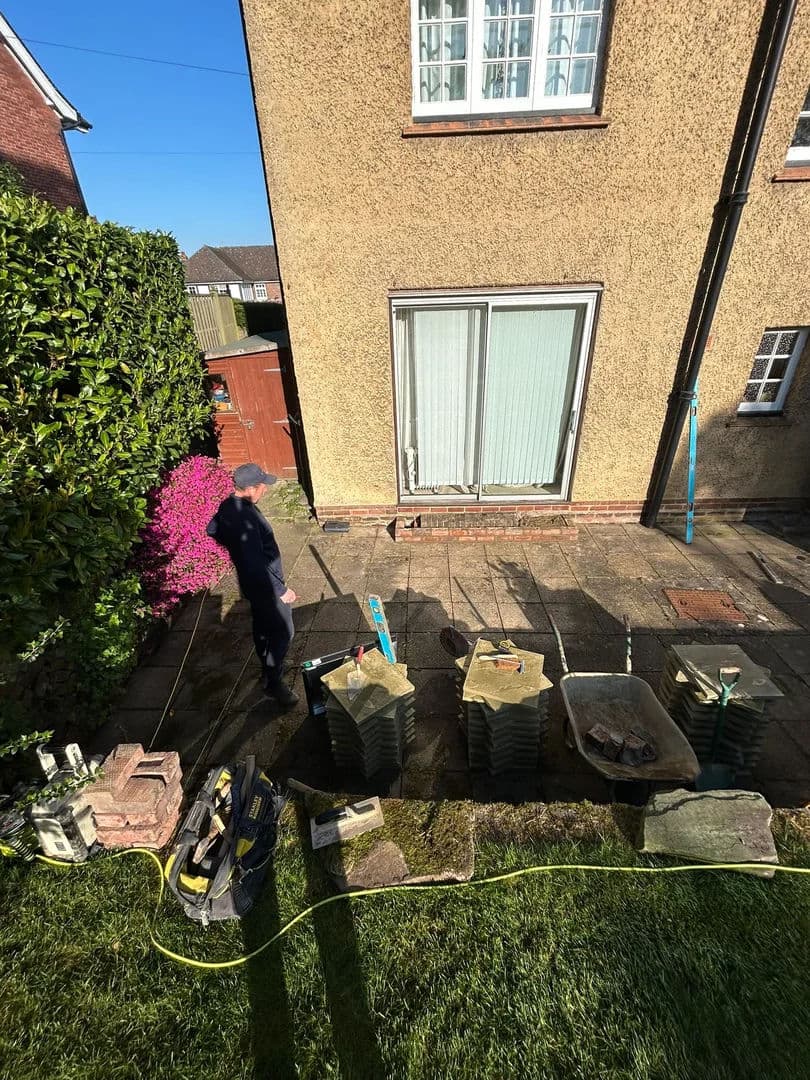 New buff Indian sandstone slabs delivered as the old patio is lifted